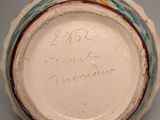 a close up of a vase with writing on it