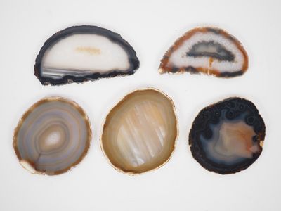 four different types of agate on a white surface