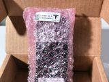 a box with a bunch of black and white beads inside of it