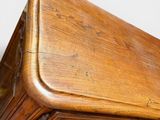 a wooden box with a handle on top of it