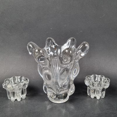 a glass vase with three pieces of glass in it
