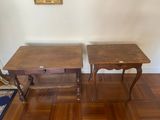 two tables that are sitting next to each other on the floor
