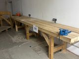 a long wooden bench in the middle of a room