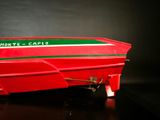 a red boat that is sitting on a table