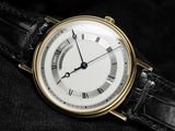 an image of a close up of a wrist watch with roman numerals