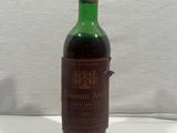 a bottle of wine that is sitting on a table