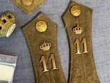a pair of gold buttons on a pair of gold buttons