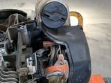 a close up of a motorcycle engine in a garage