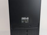 a black desktop computer sitting on a white surface