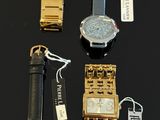 many different types of watches on a black surface