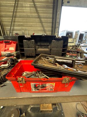 a red box with tools in it in a garage