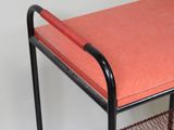 a small table with a red cover on it