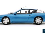 the blue car is parked on a white surface with the door open