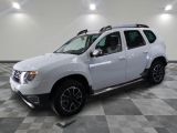 a picture of a white dacia parked in a garage