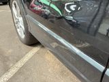 graffiti on the side of a car in a parking lot