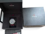 a black box with a watch inside of it