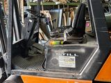 a fork lift truck that is parked in a garage