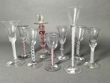 a group of wine glasses sitting next to each other on a table