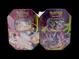 two tins of pokemon cards are sitting side by side on a black background