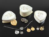 a heart shaped box with many different items in it