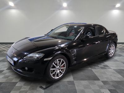 an image of a black sports car in a garage