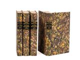 two books sitting on top of each other on a white surface