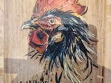 a painting of a rooster on a wooden plaque