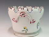 a white bowl with a floral design on it