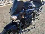 a motorcycle that is parked on the side of the road