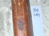 an old book sitting on a table with a price tag on it