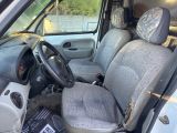 the interior of a car with a steering wheel and a seat cover