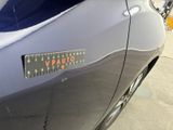 a close up of a car with a sticker on it