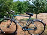 a bike that is parked on a wooden pallet