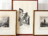 three framed pictures of a castle and a castle with a clock