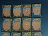 six boxes of magic the gathering cards are sitting on a table