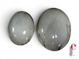 pair of two gray oval cabochles on a white background