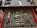 a tool box with tools in it on a table