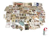a pile of old postcards on a white surface