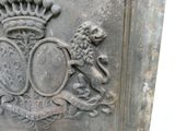 a stone plaque with a lion and a crown on it