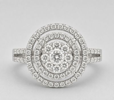 a close up of a diamond ring on a white background