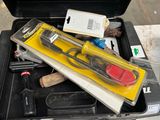 a tool box with tools in it sitting on a table