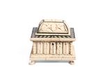 an antique ivory casket with carvings of animals and birds on it