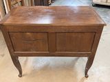 an old wooden table with two drawers and a drawer on top of it