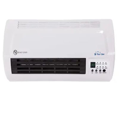 a white air conditioner sitting on top of a white table