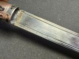 a knife that is sitting on a table