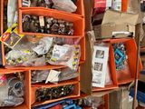 boxes of assorted items are stacked on a shelf in a warehouse
