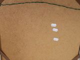 a cardboard box with a piece of paper taped around it