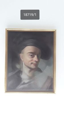 a portrait of a man with a hat on a wall