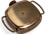 a small metal container with a handle on a white surface