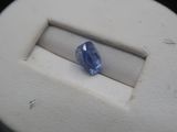 a blue stone in the middle of a white object